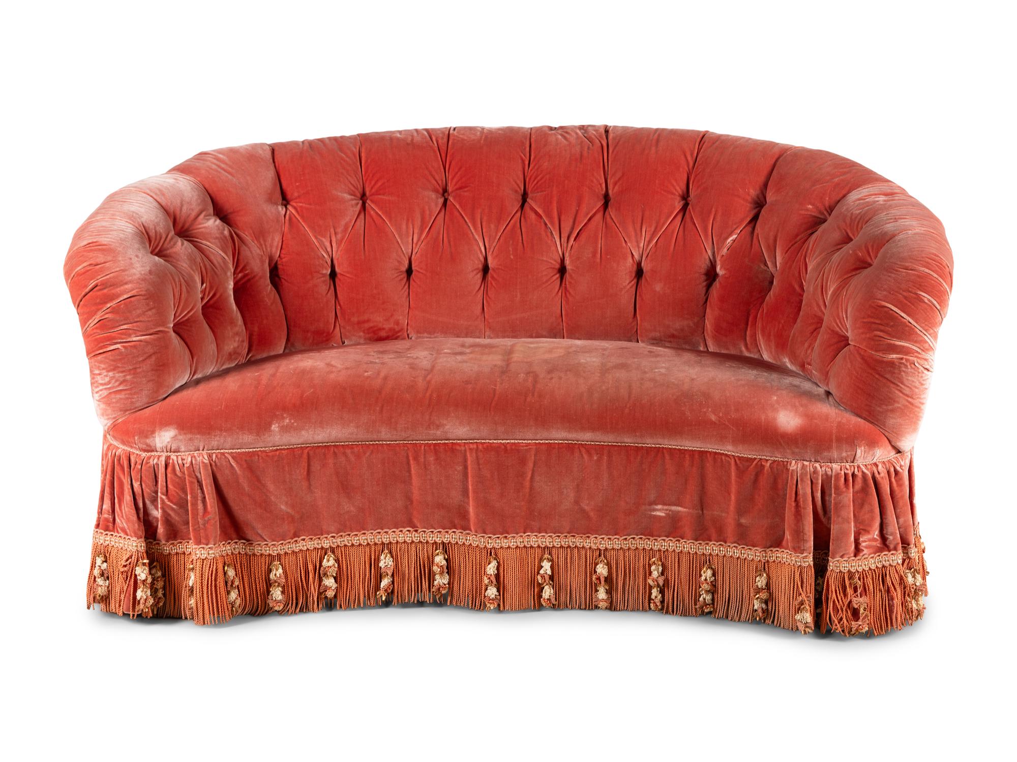 A Button-Tufted Velvet Reniform Sofa