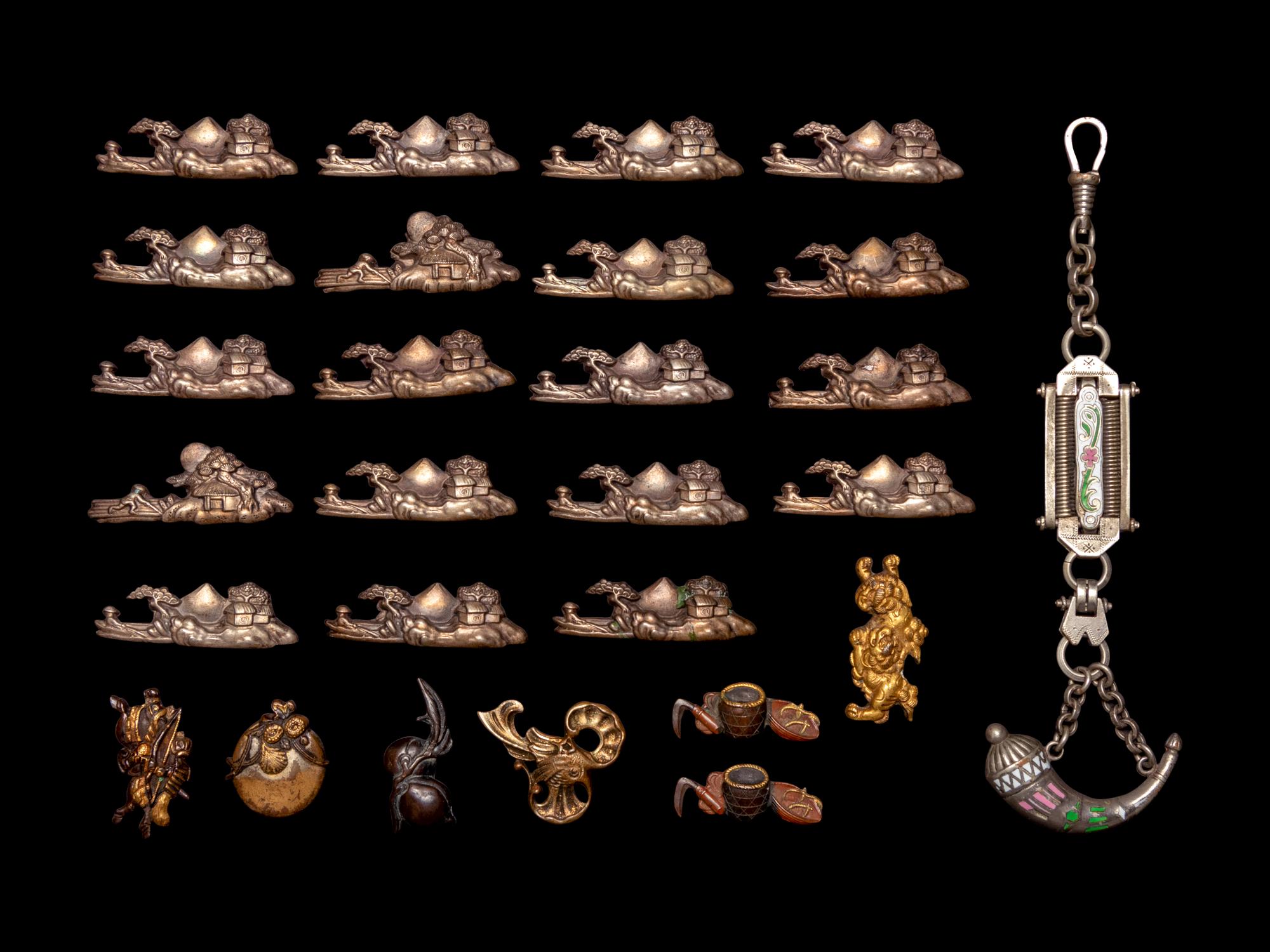 26 Mixed Metal Menuki and A Silver Flask Pendant