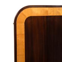 A Regency Style Mahogany and Satinwood Three-Pedestal Dining Table