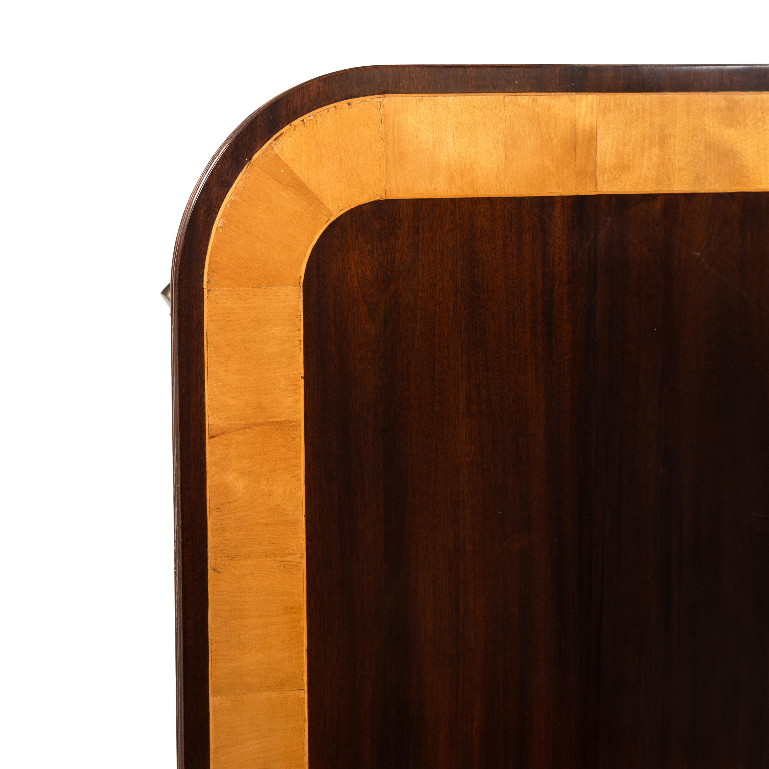 A Regency Style Mahogany and Satinwood Three-Pedestal Dining Table