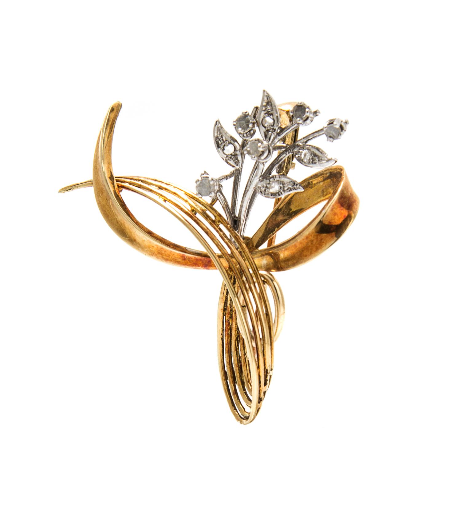 A 14 Karat Gold and Diamond Swirl Pendant/Brooch, 4.70 dwts.