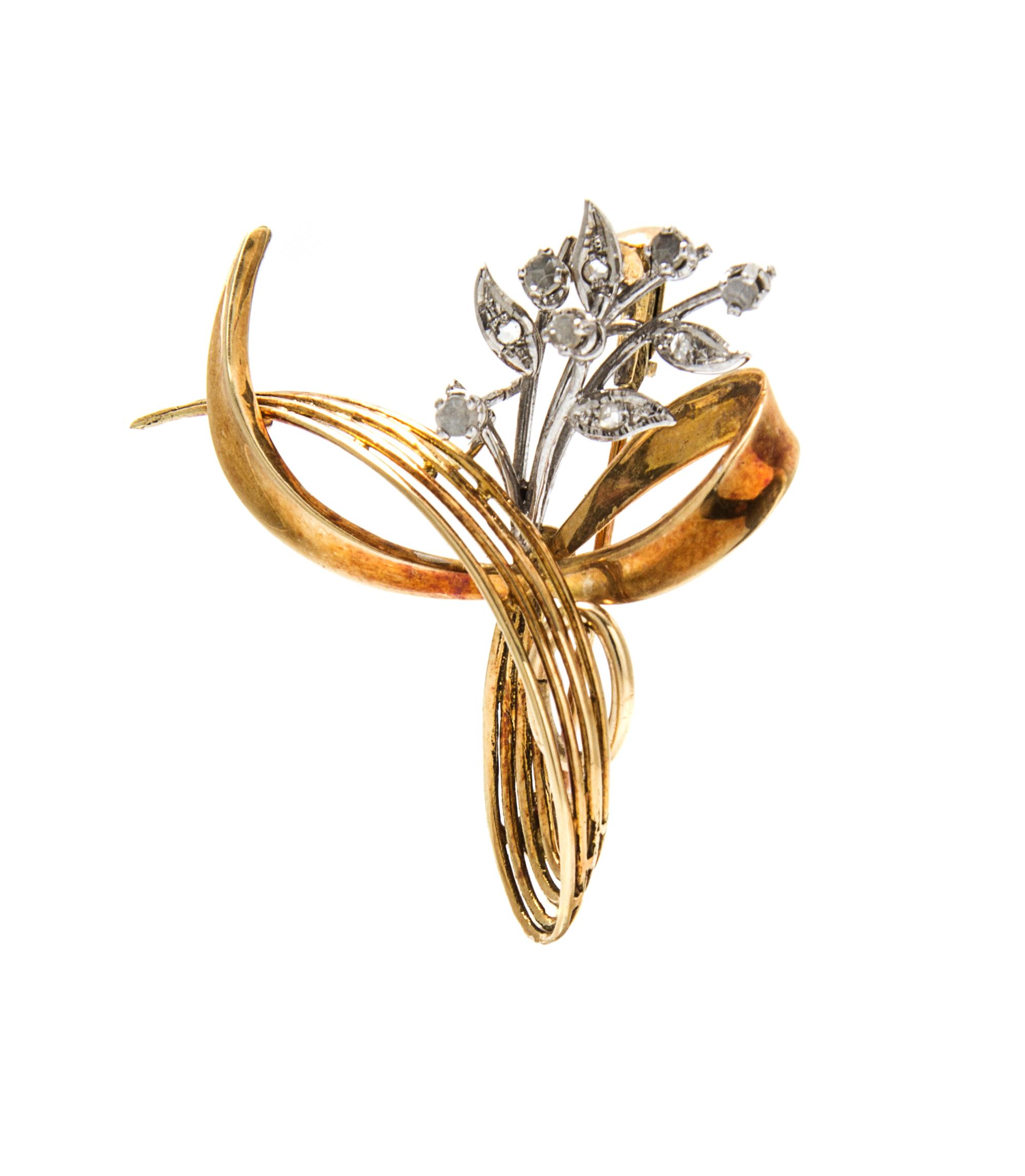 A 14 Karat Gold and Diamond Swirl Pendant/Brooch, 4.70 dwts.