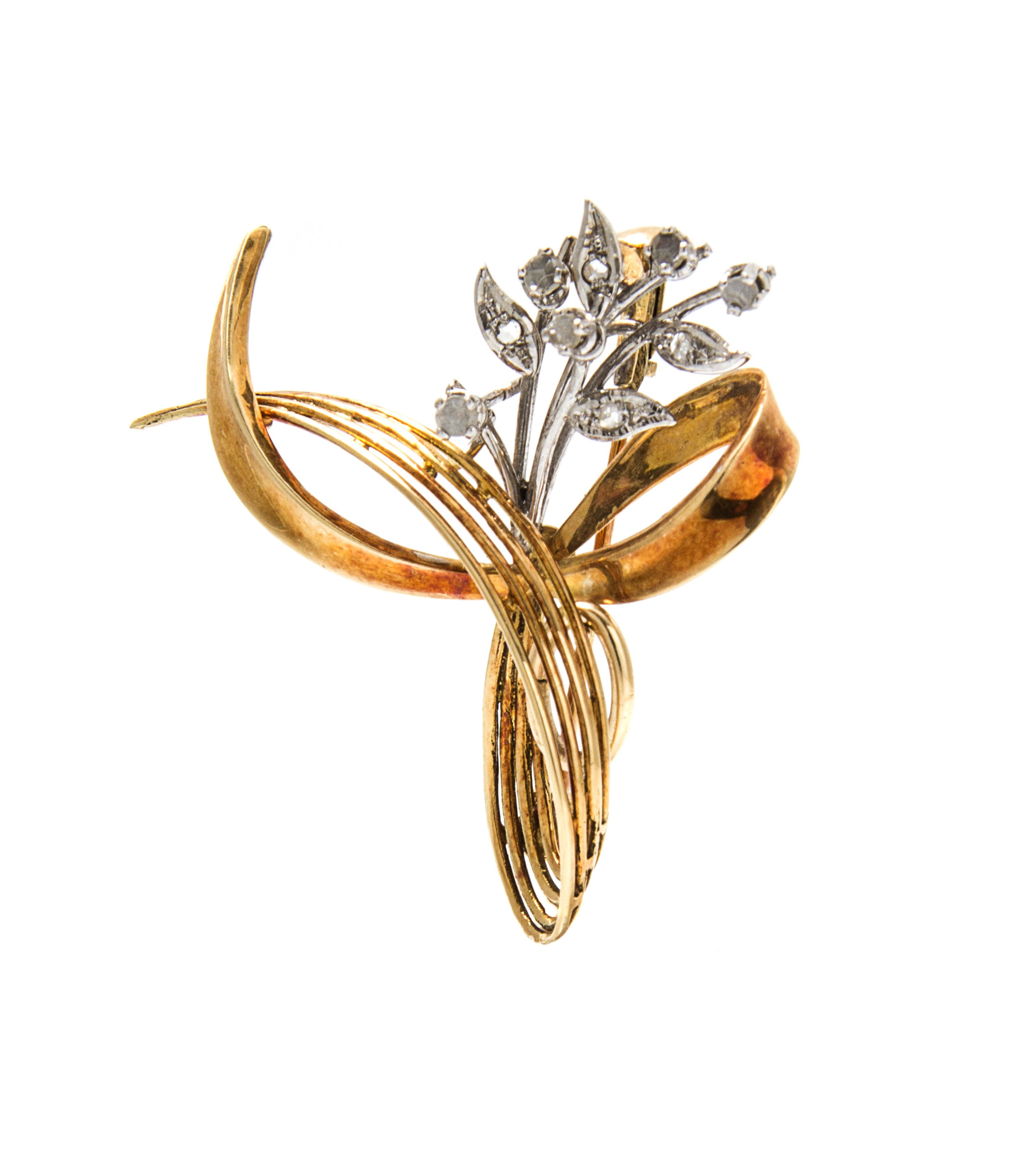A 14 Karat Gold and Diamond Swirl Pendant/Brooch, 4.70 dwts.