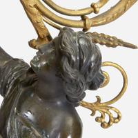 A Pair of Louis XVI Style Gilt and Patinated Bronze Figural Four-Light Candelabra 19th century