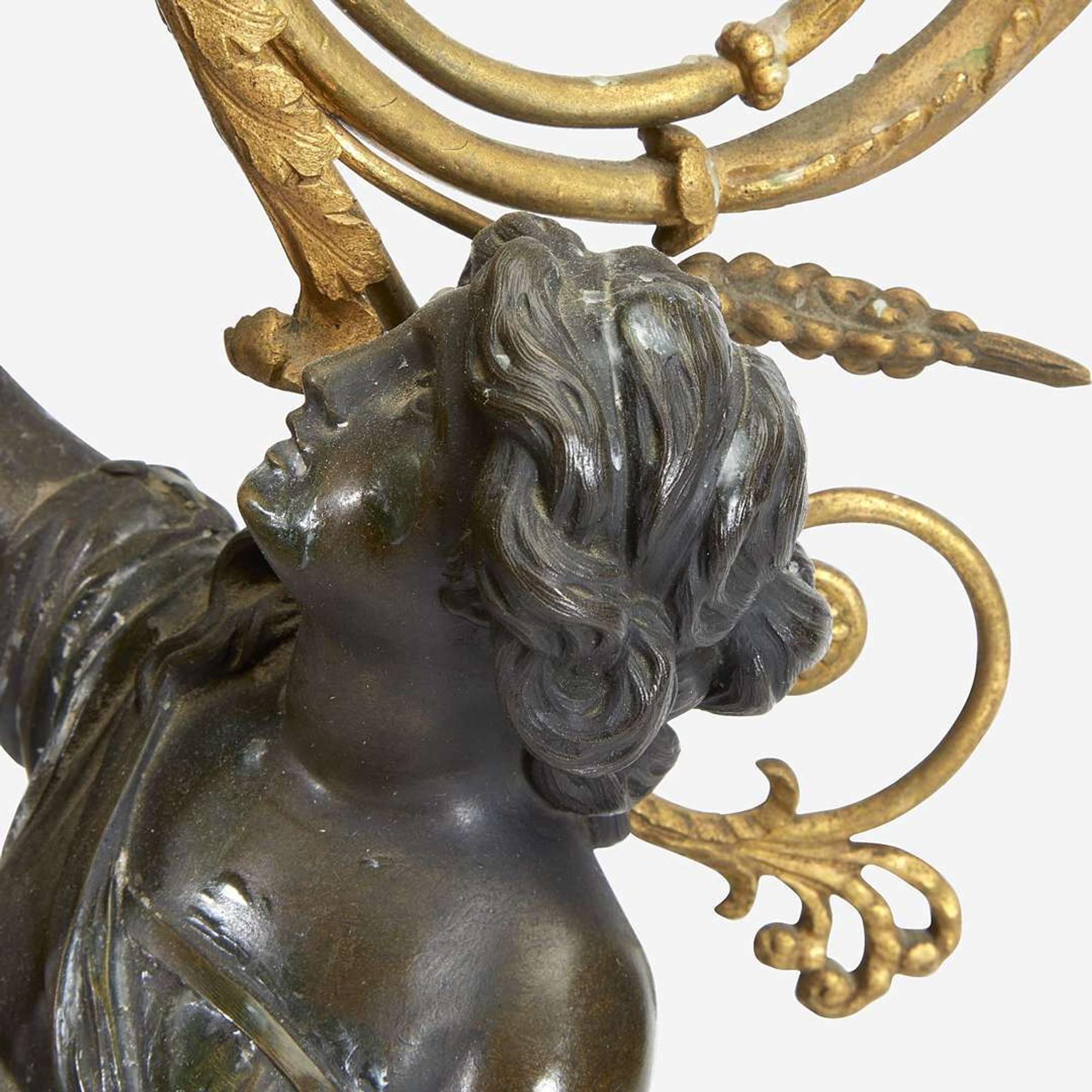 A Pair of Louis XVI Style Gilt and Patinated Bronze Figural Four-Light Candelabra 19th century