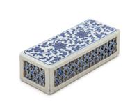 A Blue and White Porcelain Paperweight Height 1 3/4 x width 6 1/4 x depth 2 1/2 inches.