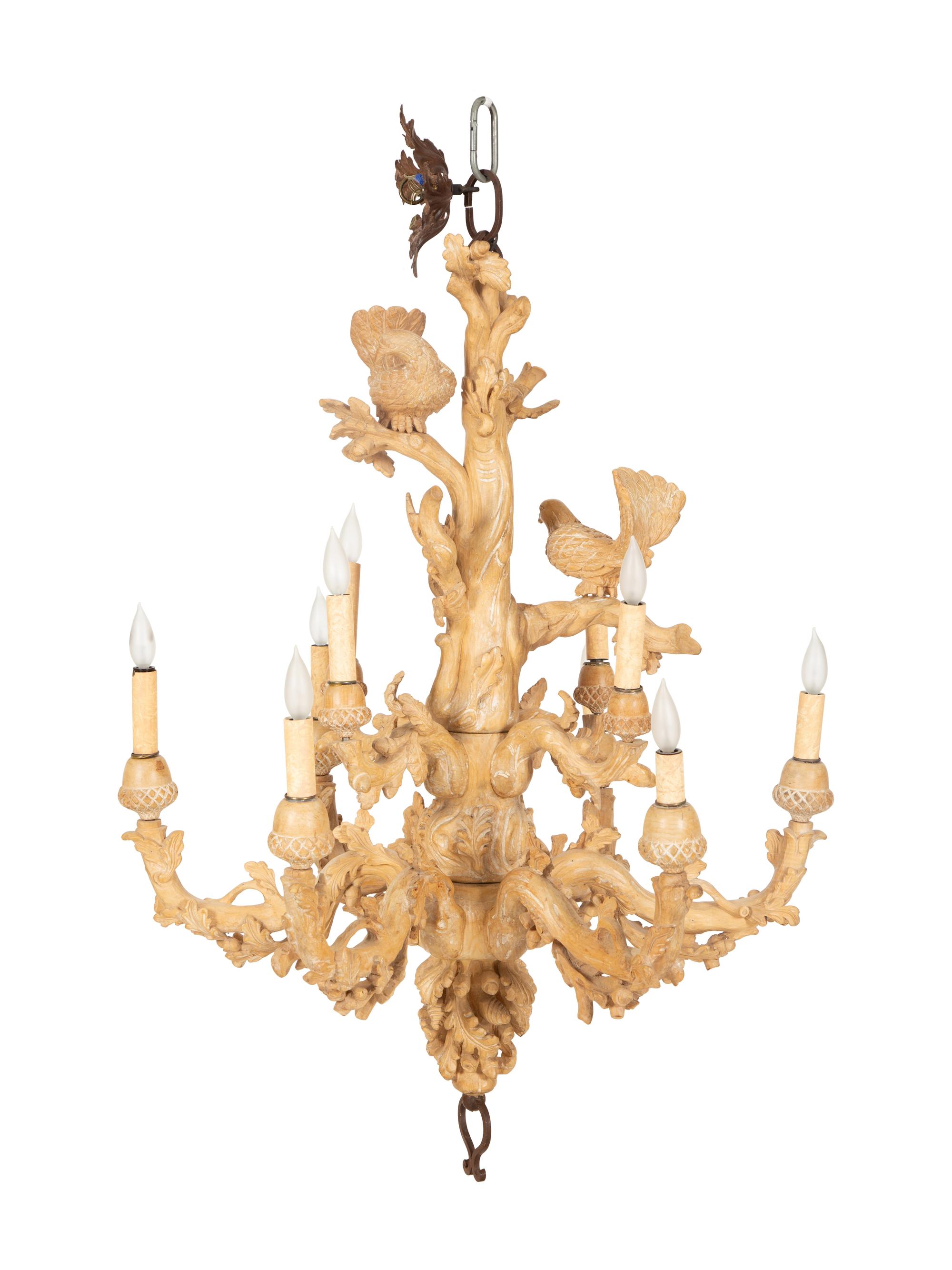A Carved Fruitwood Ten Light Chandelier
