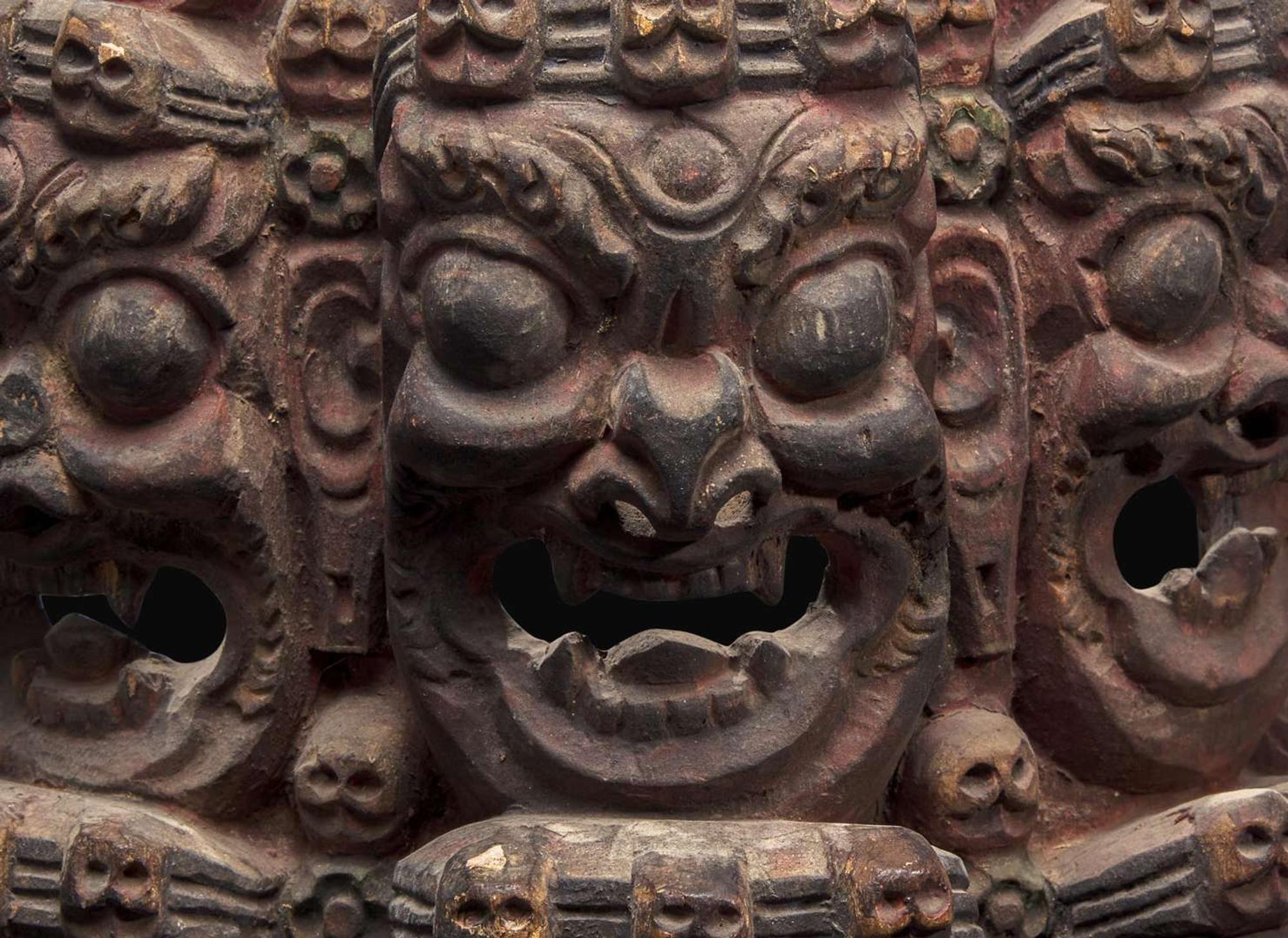 A Nepalese carved and polychromed wood mask 尼泊爾加彩木面具
