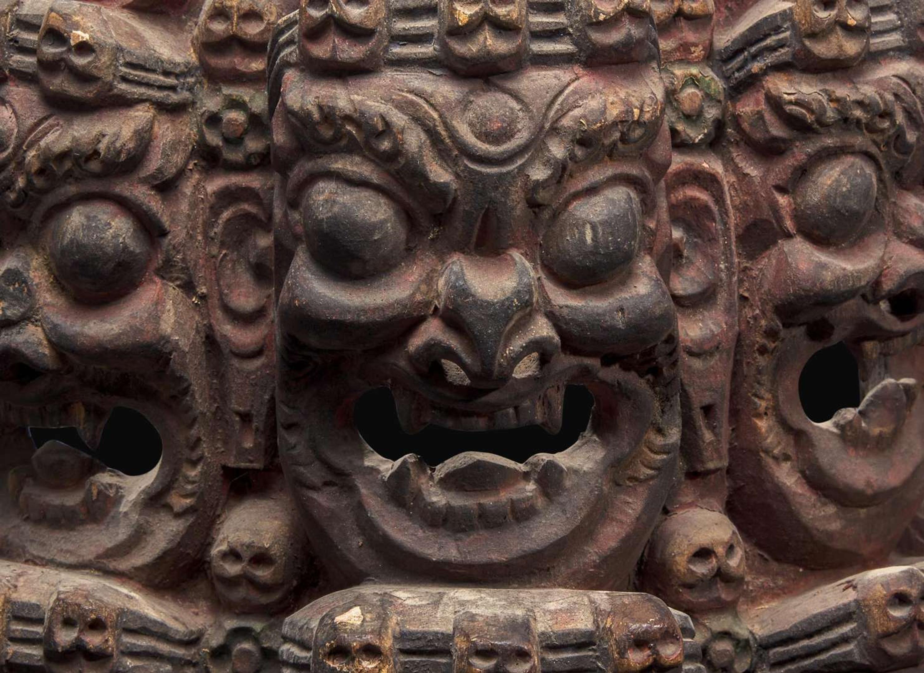 A Nepalese carved and polychromed wood mask 尼泊爾加彩木面具
