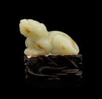 A Carved Russet and White Jade Figure of Mythical Beast, Tianlu