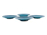 A Set of Four Persian Turquoise Glazed Earthenware Plates