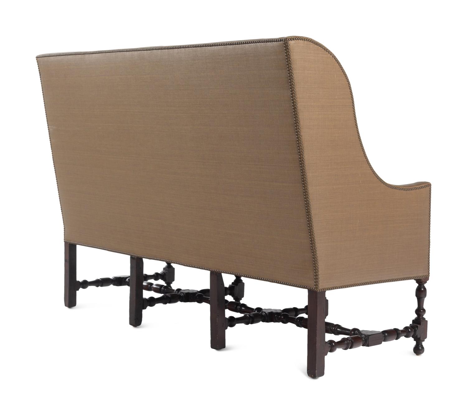 A French Walnut Wingback Sofa