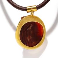 A Roman Carnelian Cameo of a Boy — Set in a gold pendant
