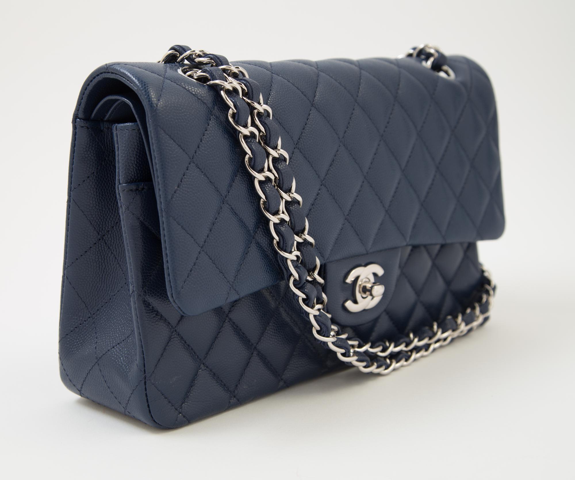 A Chanel Navy Caviar Classic Double Flap Handbag, 10" x 6" x 2.5"; Strap Drop: 9.5".
