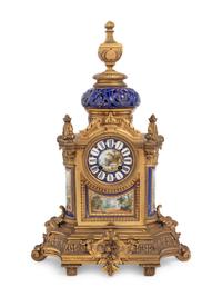 A French Porcelain Mounted Gilt Bronze Clock