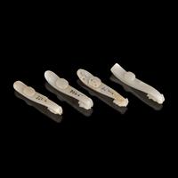 Four Chinese Greyish White Jade "Dragon" Head Belt Hooks, Qing Dynasty — 清 灰白玉龍鉤四件