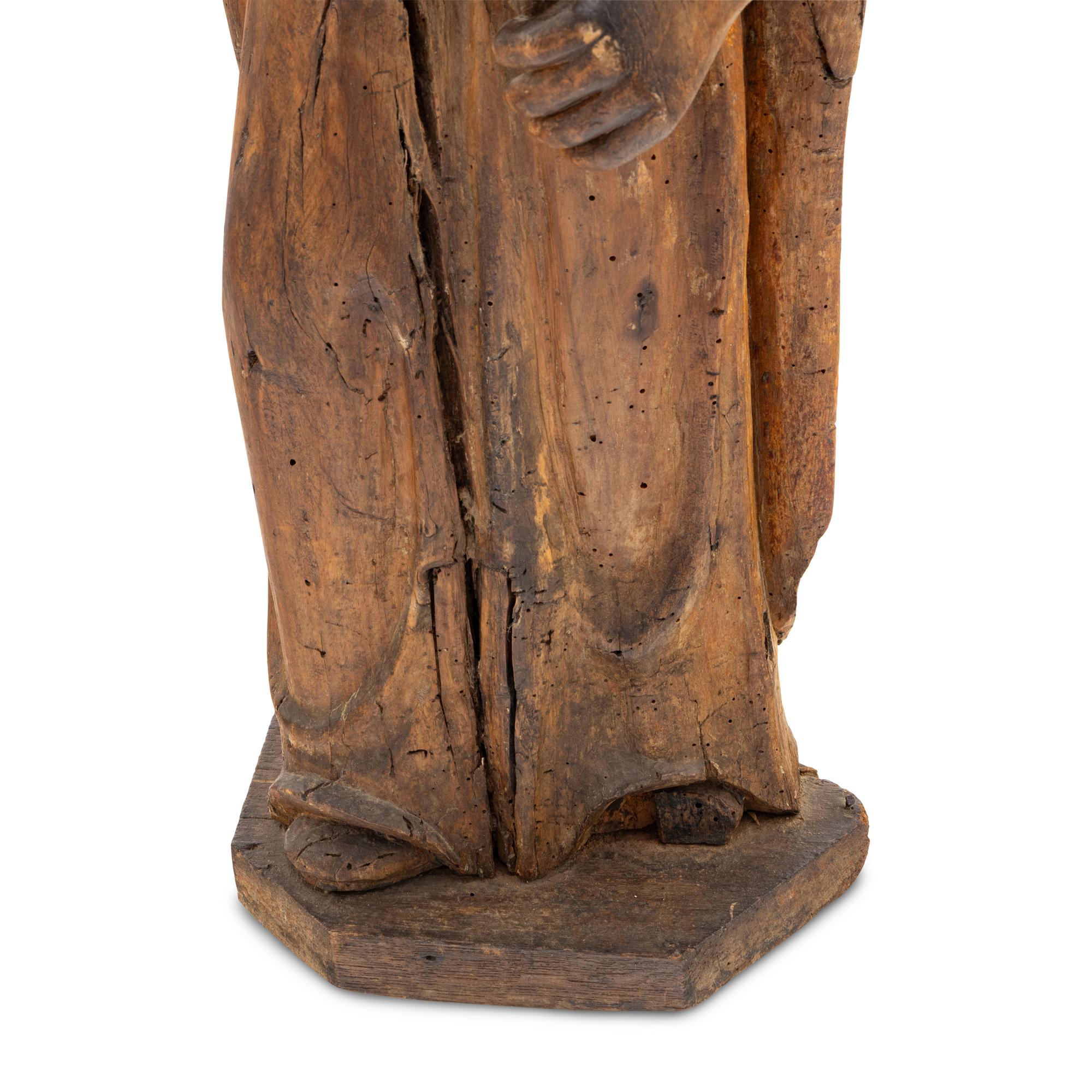 A Carved Walnut Figure of a Bishop