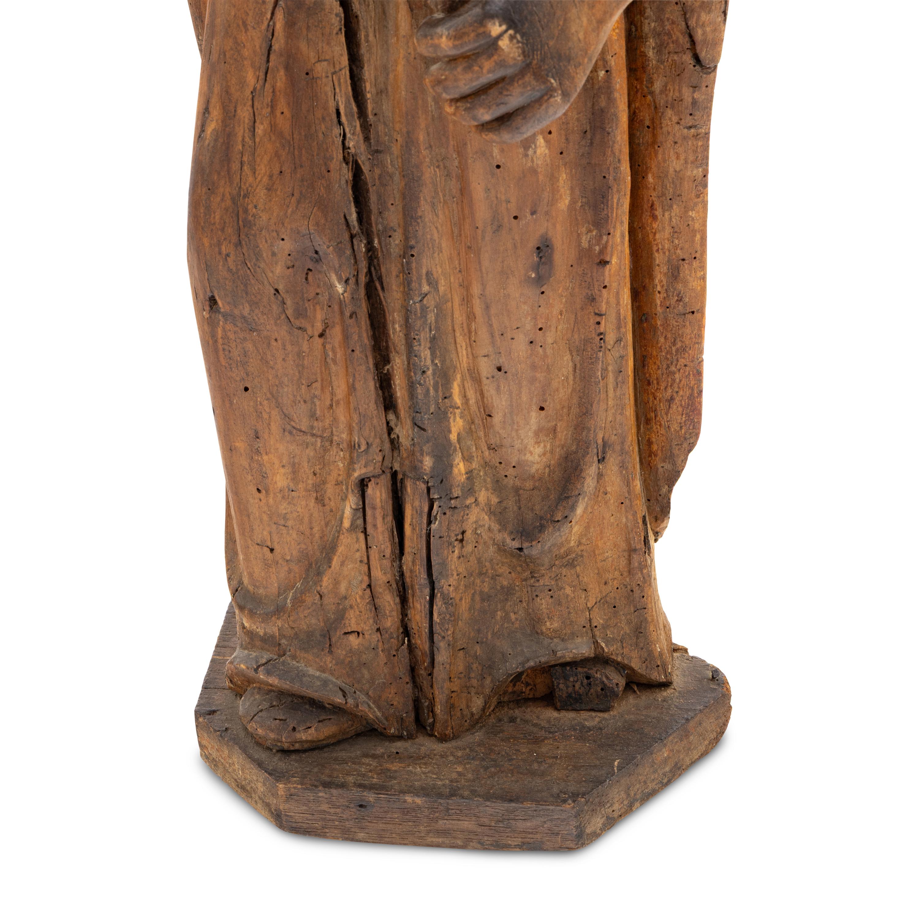 A Carved Walnut Figure of a Bishop