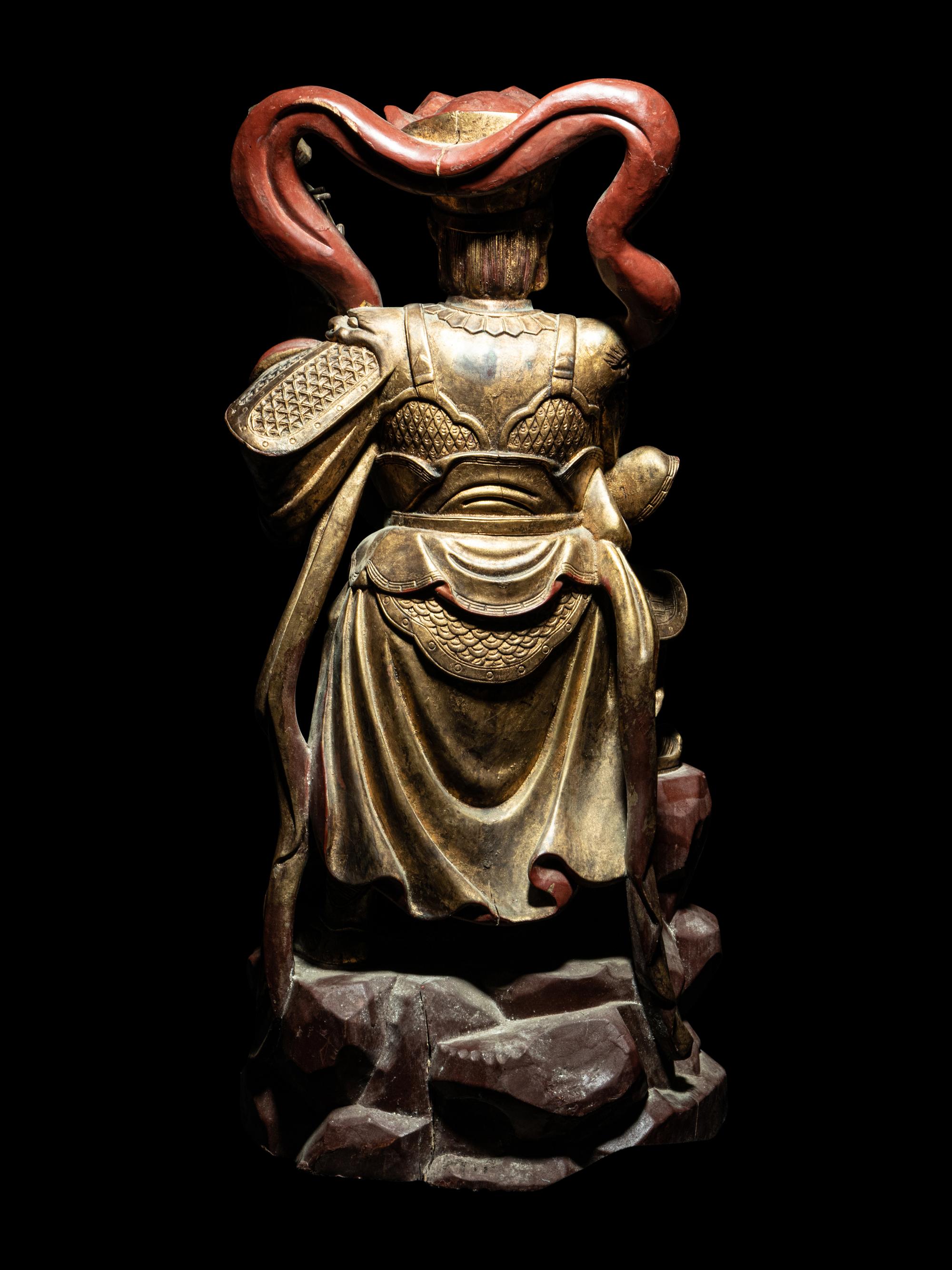 A Set of Four Gilt and Red Lacquered Wood Figures of Guardians