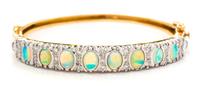 A Yellow Gold, Opal and Diamond Bangle Bracelet, 15.90 dwts.
