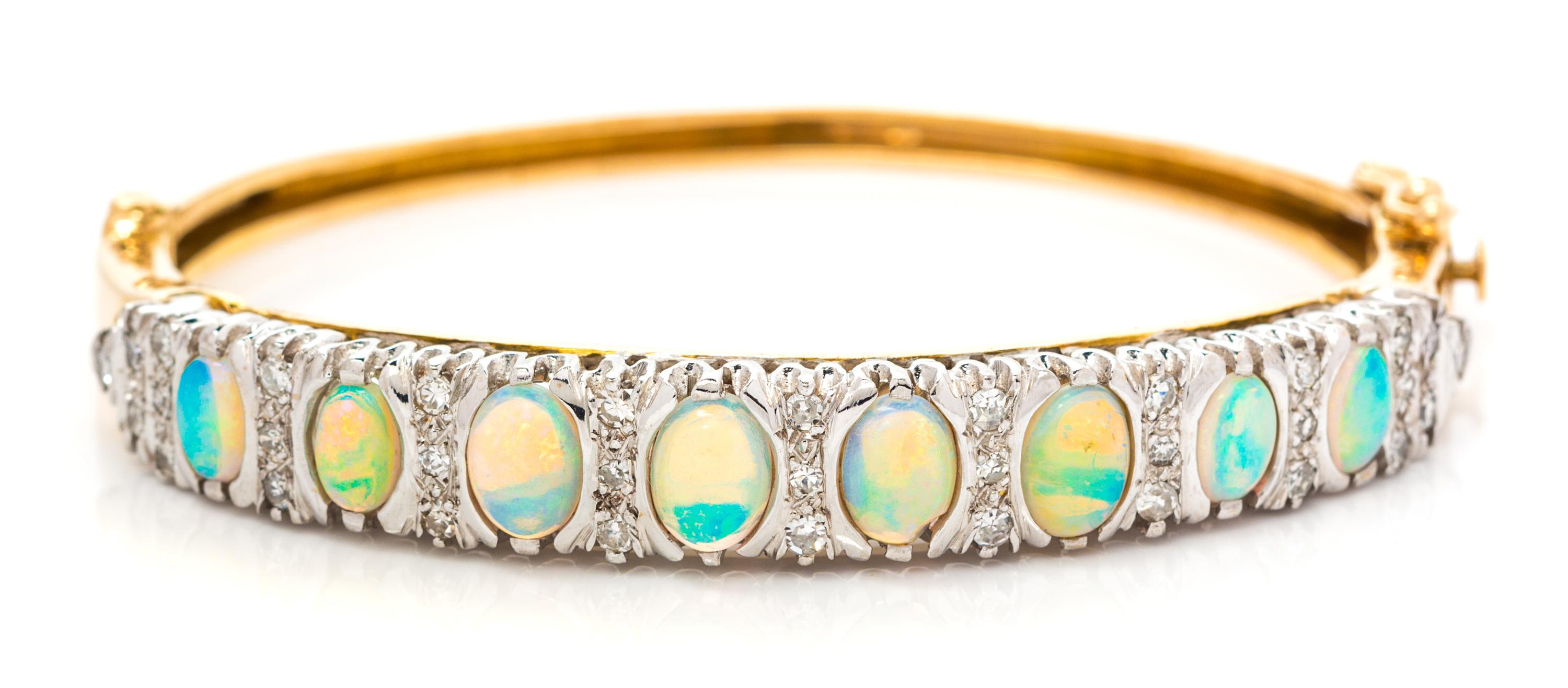 A Yellow Gold, Opal and Diamond Bangle Bracelet, 15.90 dwts.