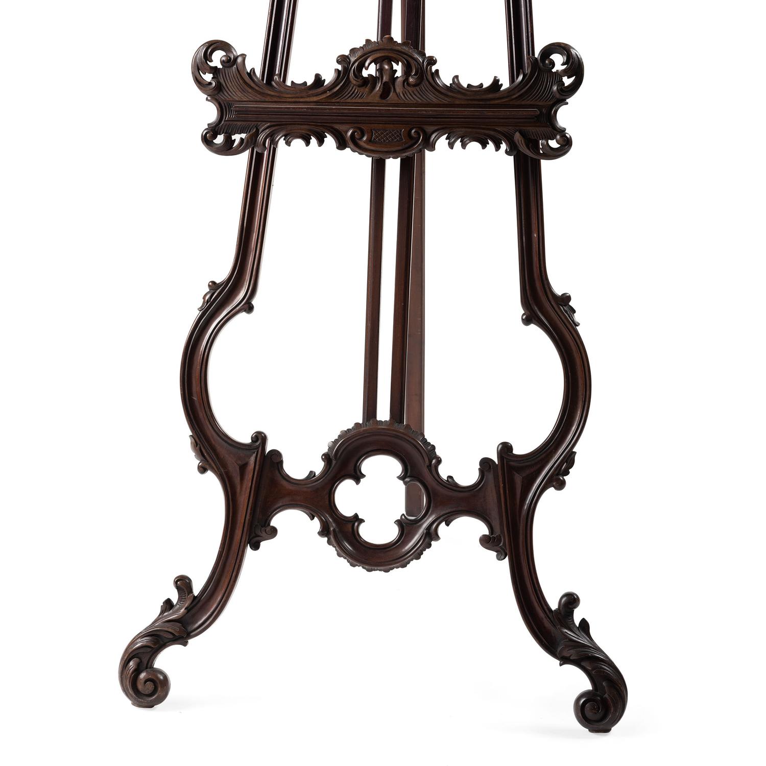 A Renaissance Revival Carved Walnut Musical Easel
