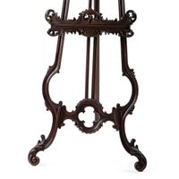 A Renaissance Revival Carved Walnut Musical Easel