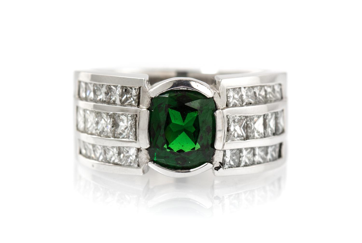 A 14 Karat White Gold, Tsavorite Garnet and Diamond Ring, 14.60 dwts.