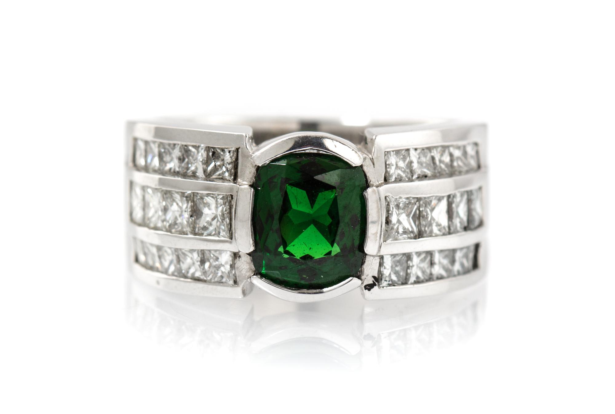 A 14 Karat White Gold, Tsavorite Garnet and Diamond Ring, 14.60 dwts.