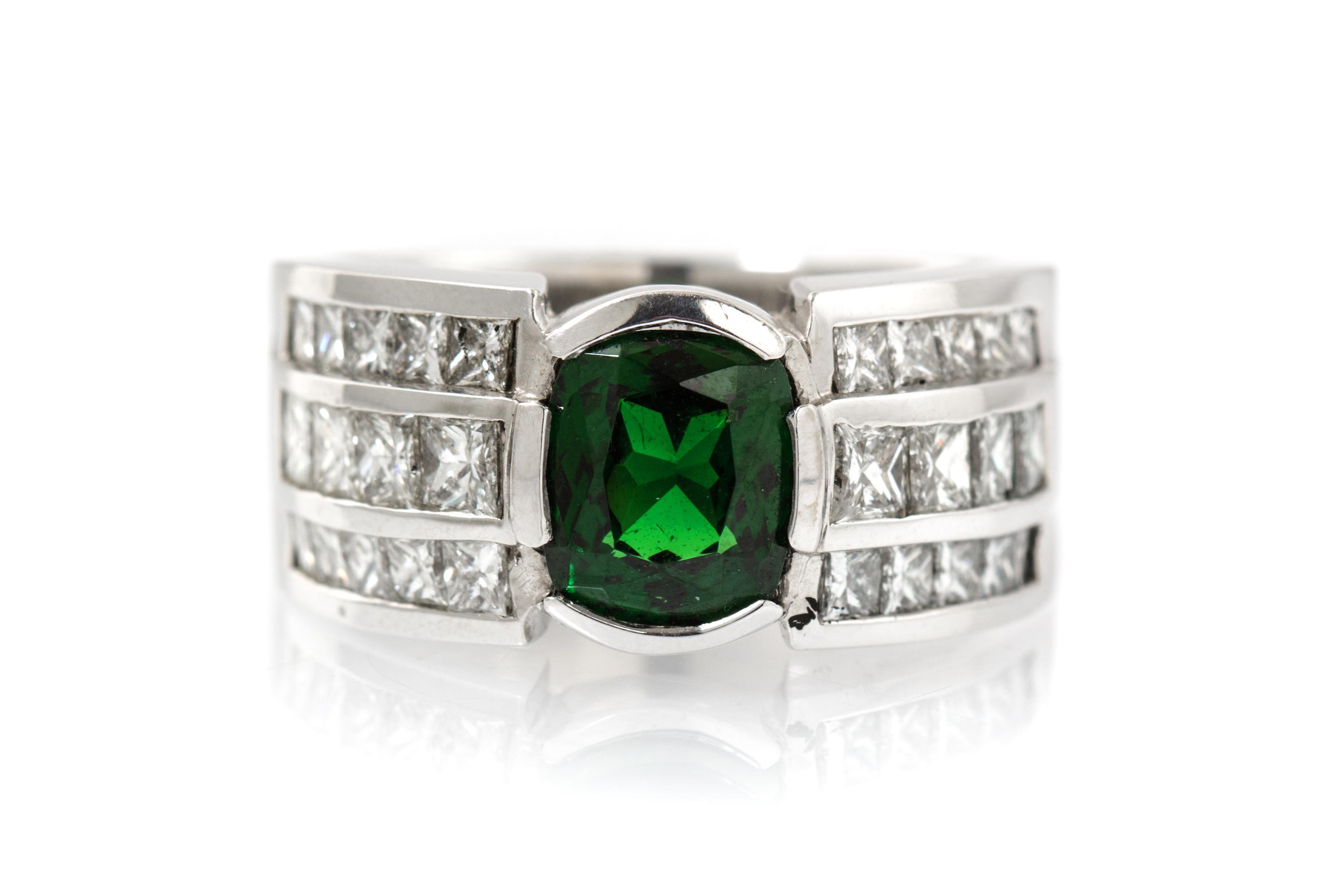 A 14 Karat White Gold, Tsavorite Garnet and Diamond Ring, 14.60 dwts.