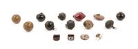 Thirteen Chinese Hardstone and Glass Pendants Diameter of largest 2 inches.