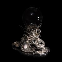 A Japanese Rock Crystal Sphere and Silver 'Dragon and Waves' Stand, Signed Yoshimasa Saku Meiji/Taisho Period 日本明治/大正時期 義正作潮を支配する珠と龍