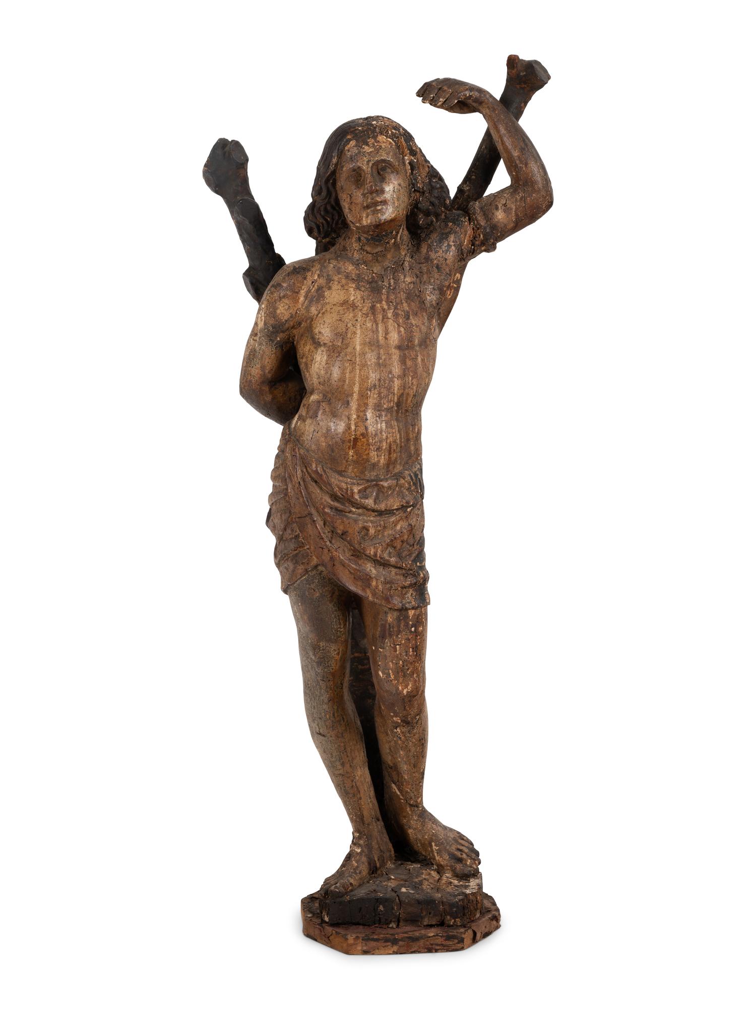 An Italian Carved and Polychromed Figure of St. Sebastian Tied to the Tree