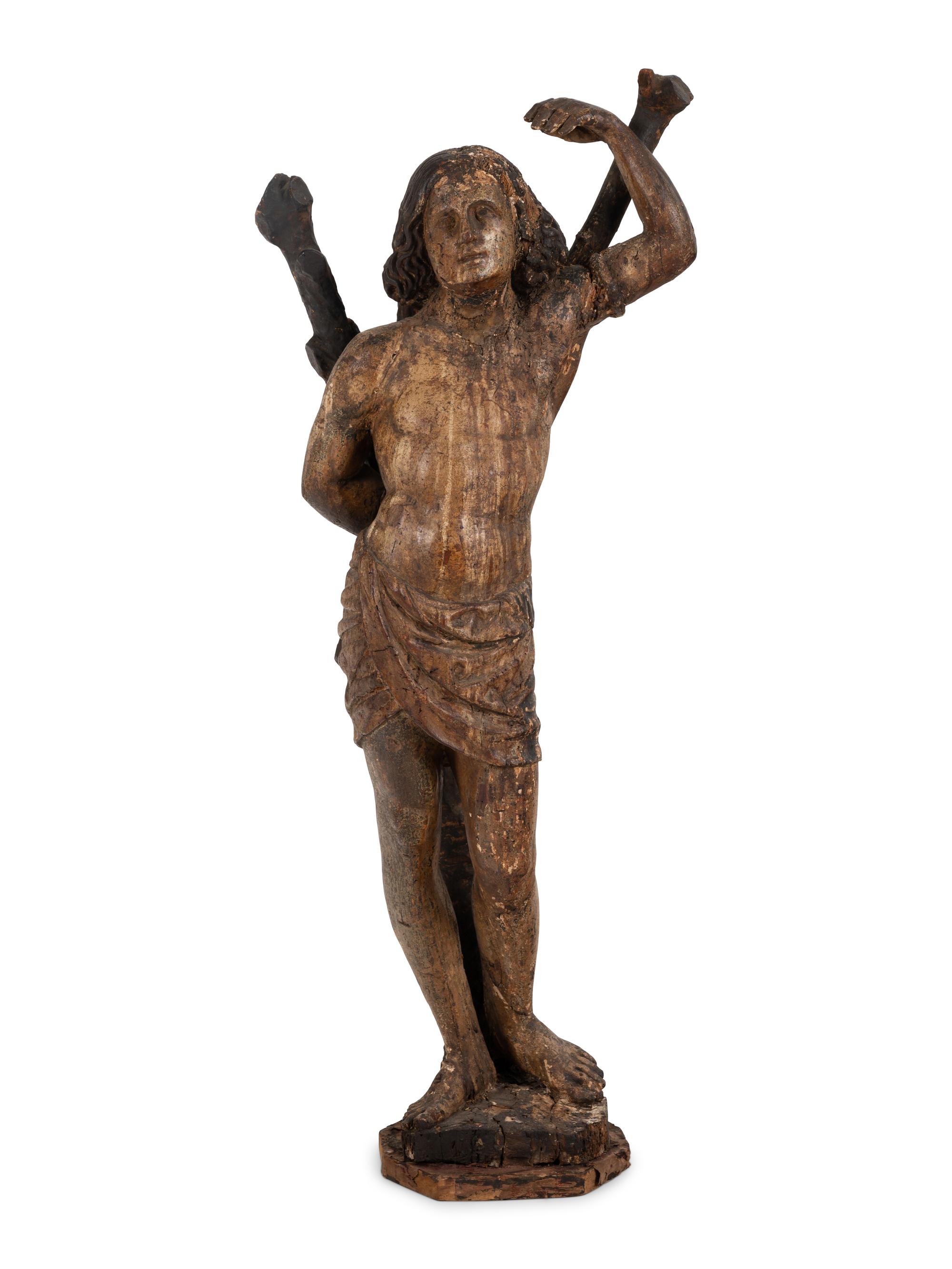 An Italian Carved and Polychromed Figure of St. Sebastian Tied to the Tree