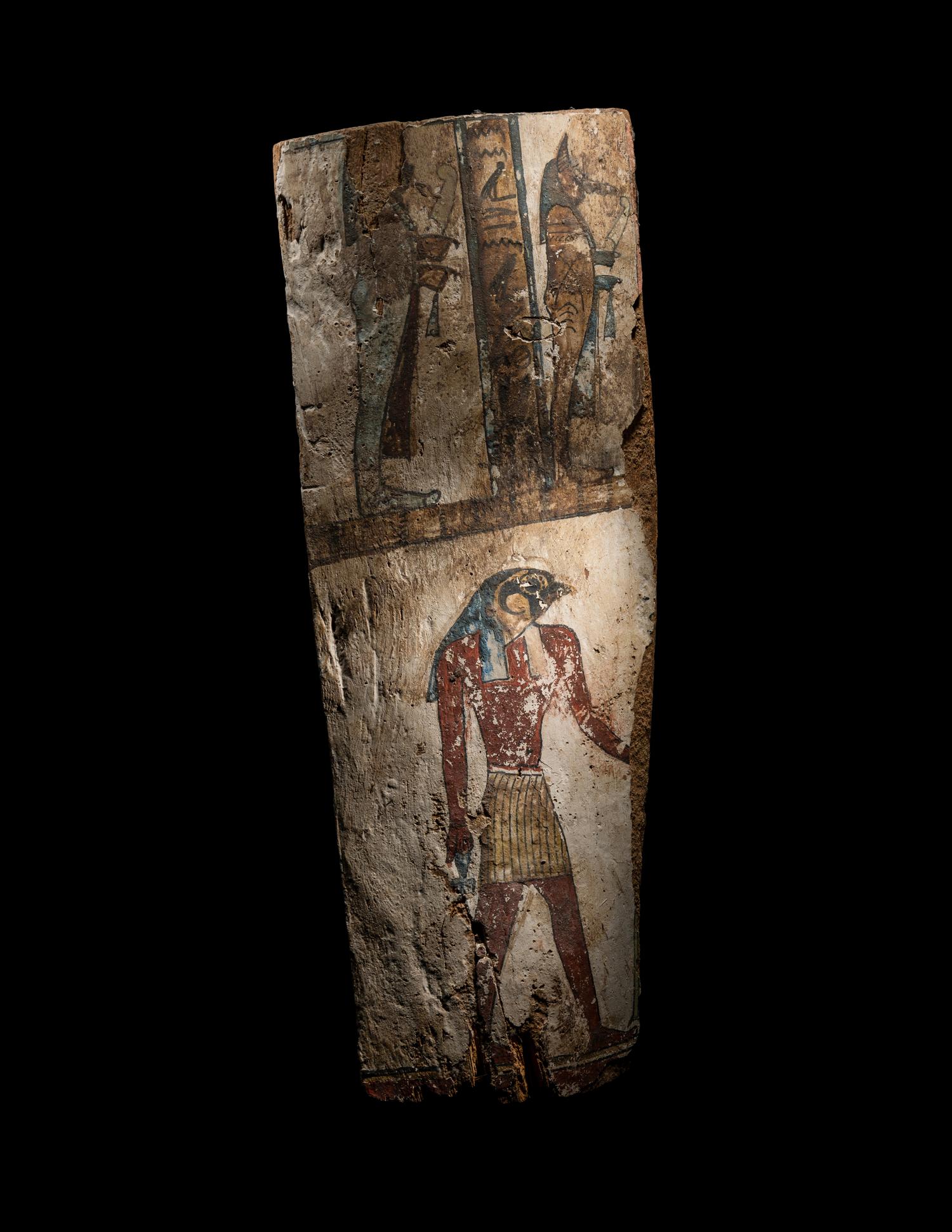 An Egyptian Painted Wood Sarcophagus Panel with the Sons of Horus