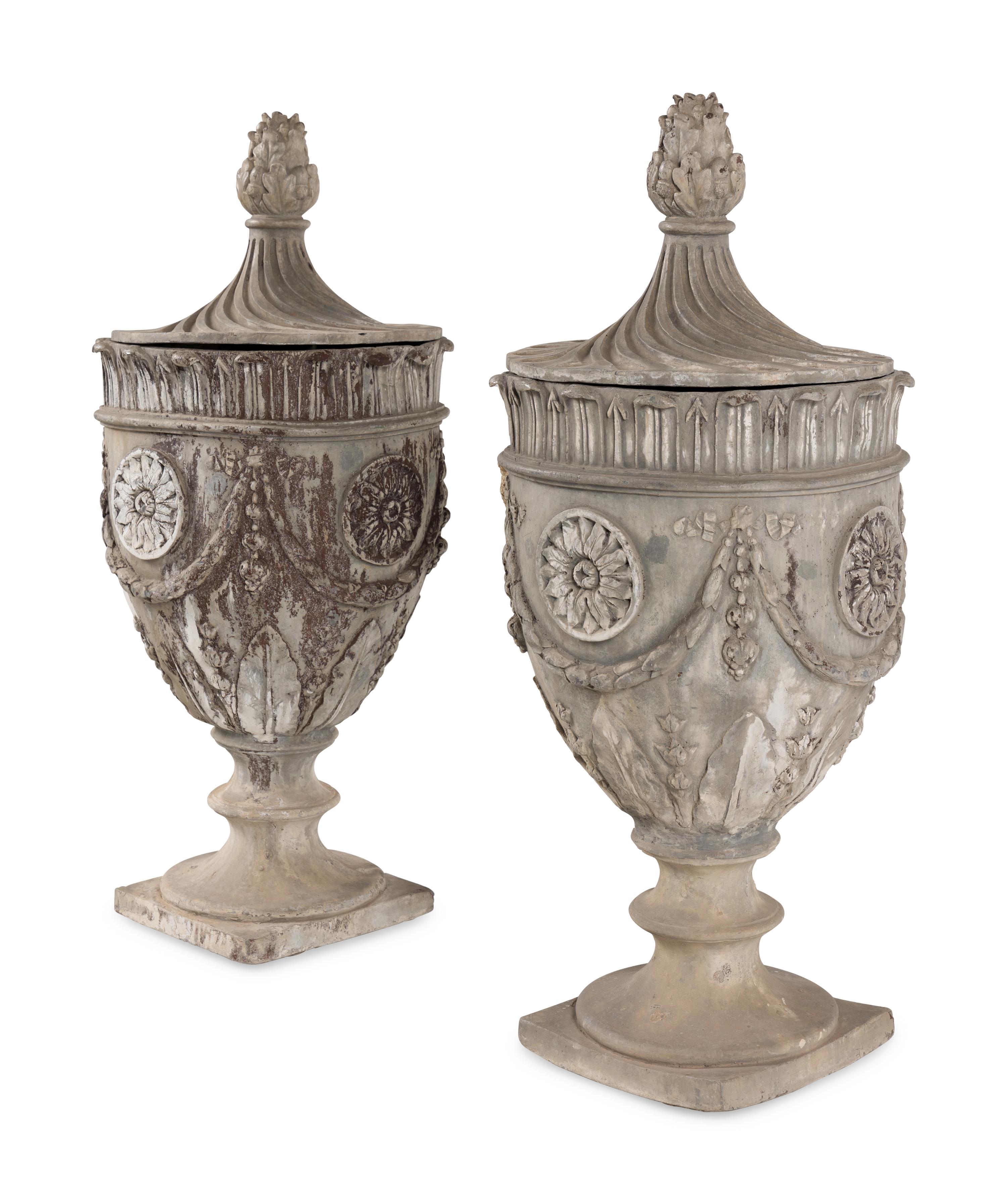A Pair of Lead Garden Urns and Covers