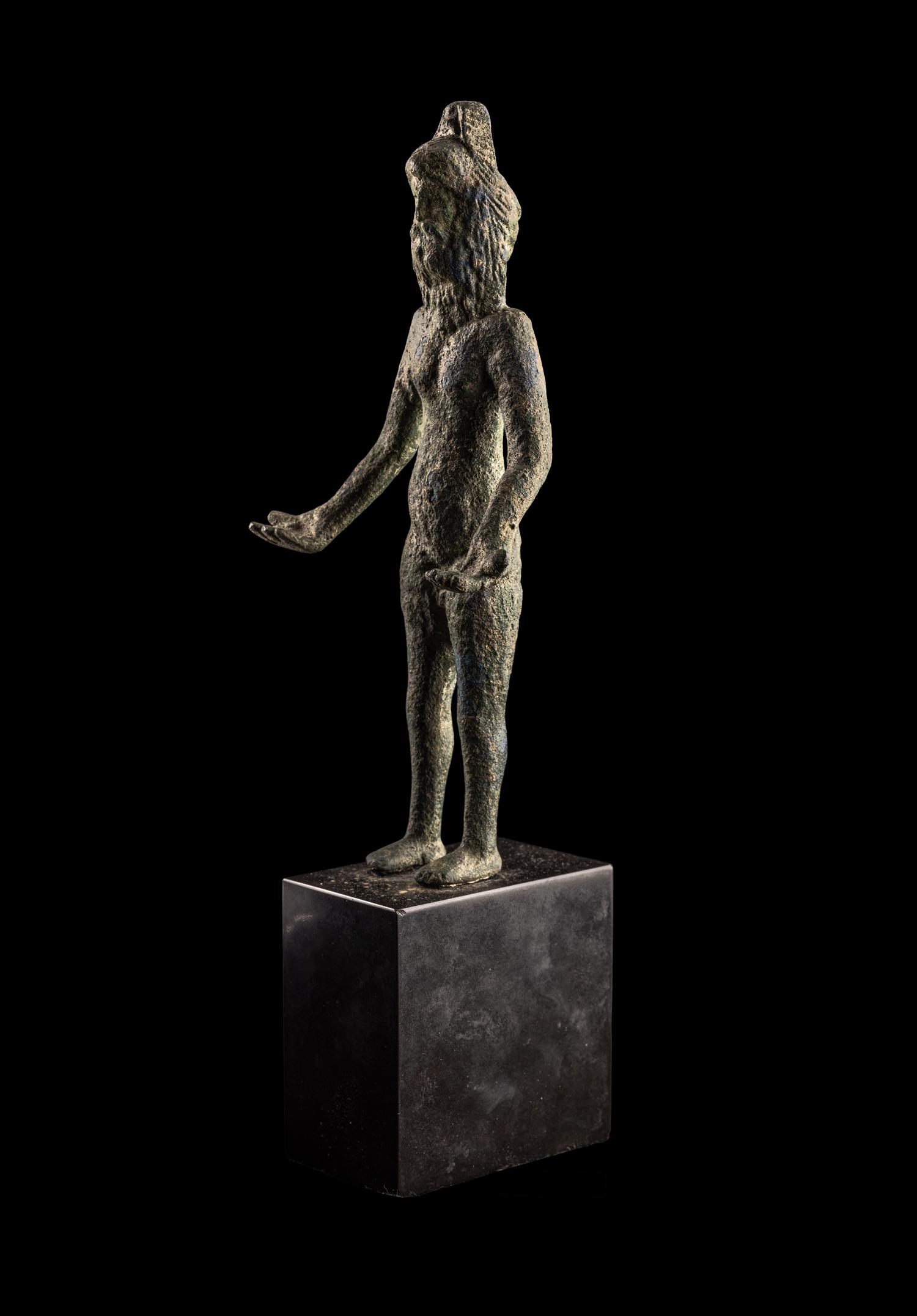 An Etruscan Bronze Female Figure Wearing a Theater Mask