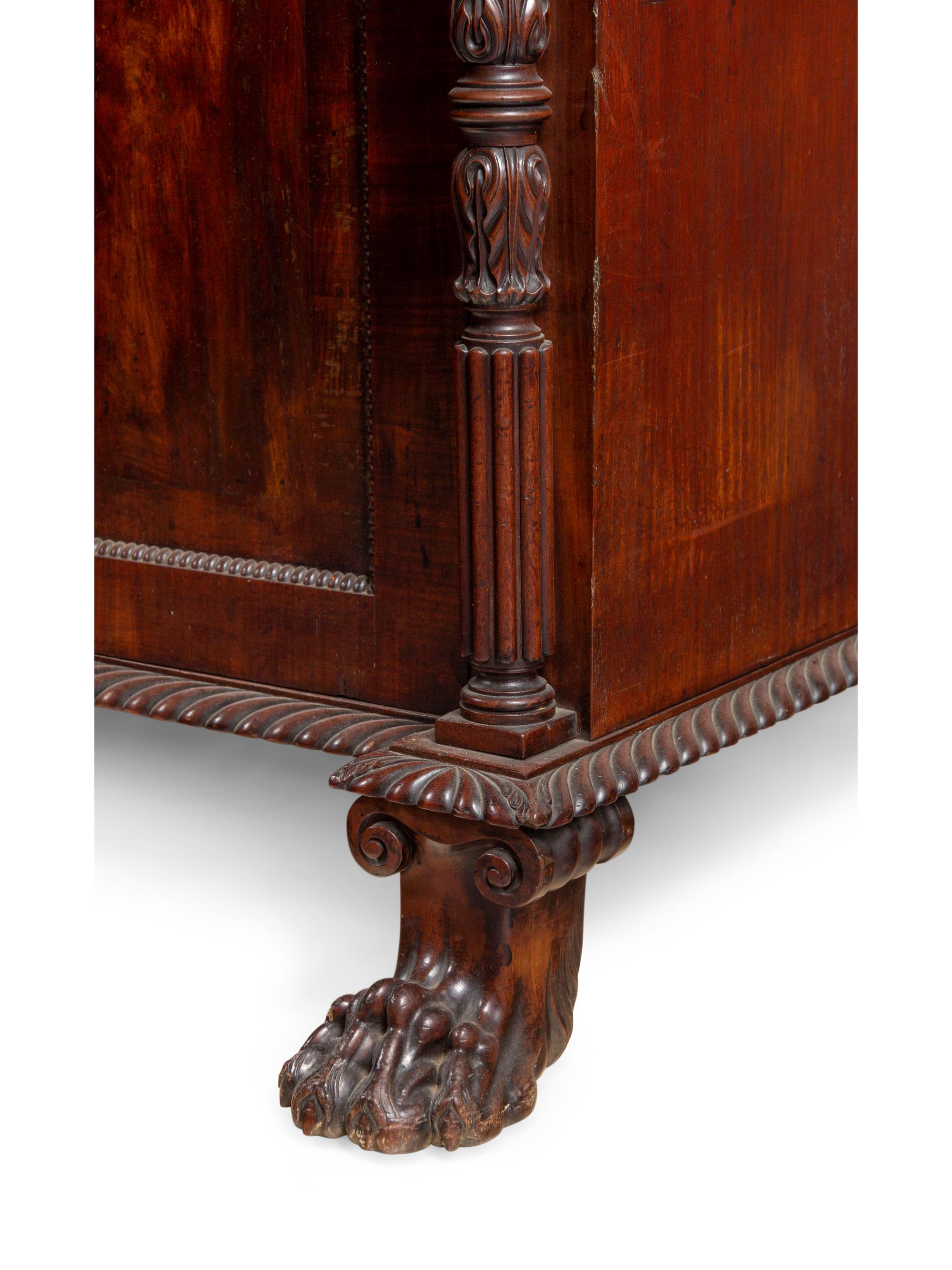 A Regency Carved and Figured Mahogany Secretary Bookcase