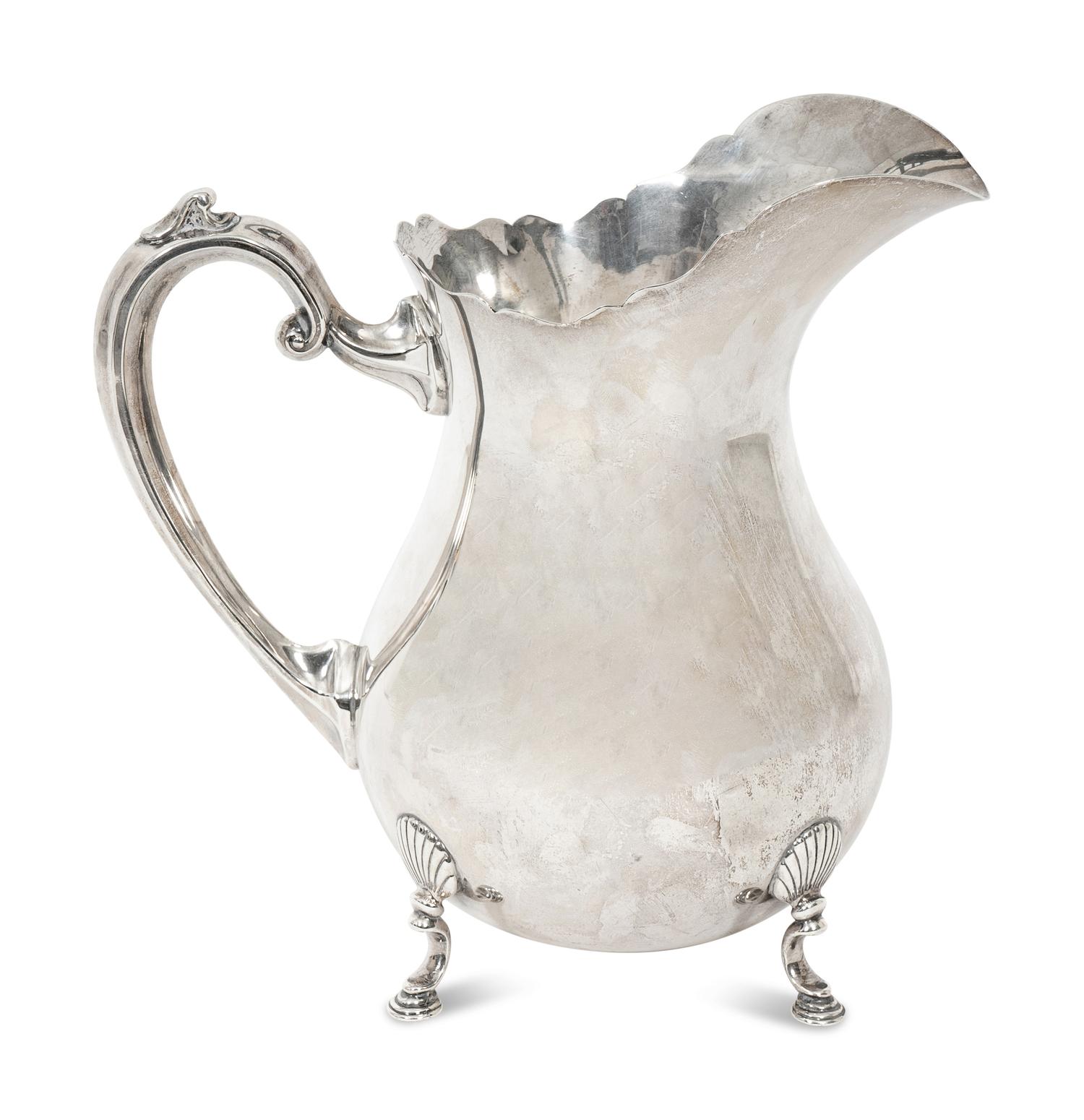 An American Fisher Sterling Silver Water Pitcher and A Cartier Sterling Silver Novelty Model of a Watering Can