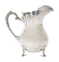 An American Fisher Sterling Silver Water Pitcher and A Cartier Sterling Silver Novelty Model of a Watering Can