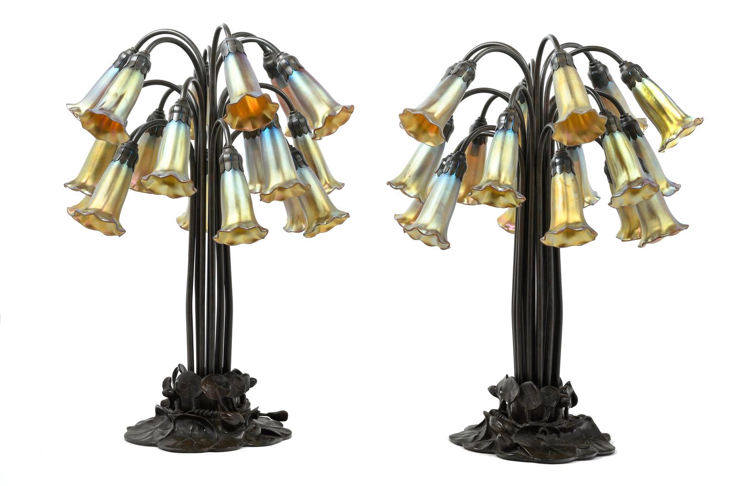 A Pair of Art Nouveau Style Patinated Metal and Iridescent Glass Eighteen-Light Tulip Lamps