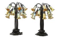 A Pair of Art Nouveau Style Patinated Metal and Iridescent Glass Eighteen-Light Tulip Lamps