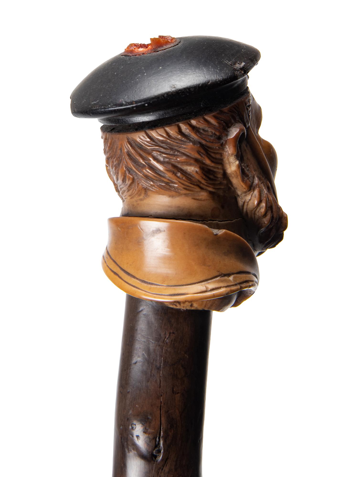 Two Figural Carved Canes