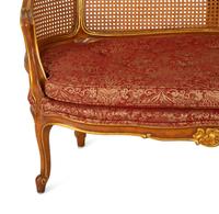 A Pair of Louis XV Style Stained and Giltwood Settees