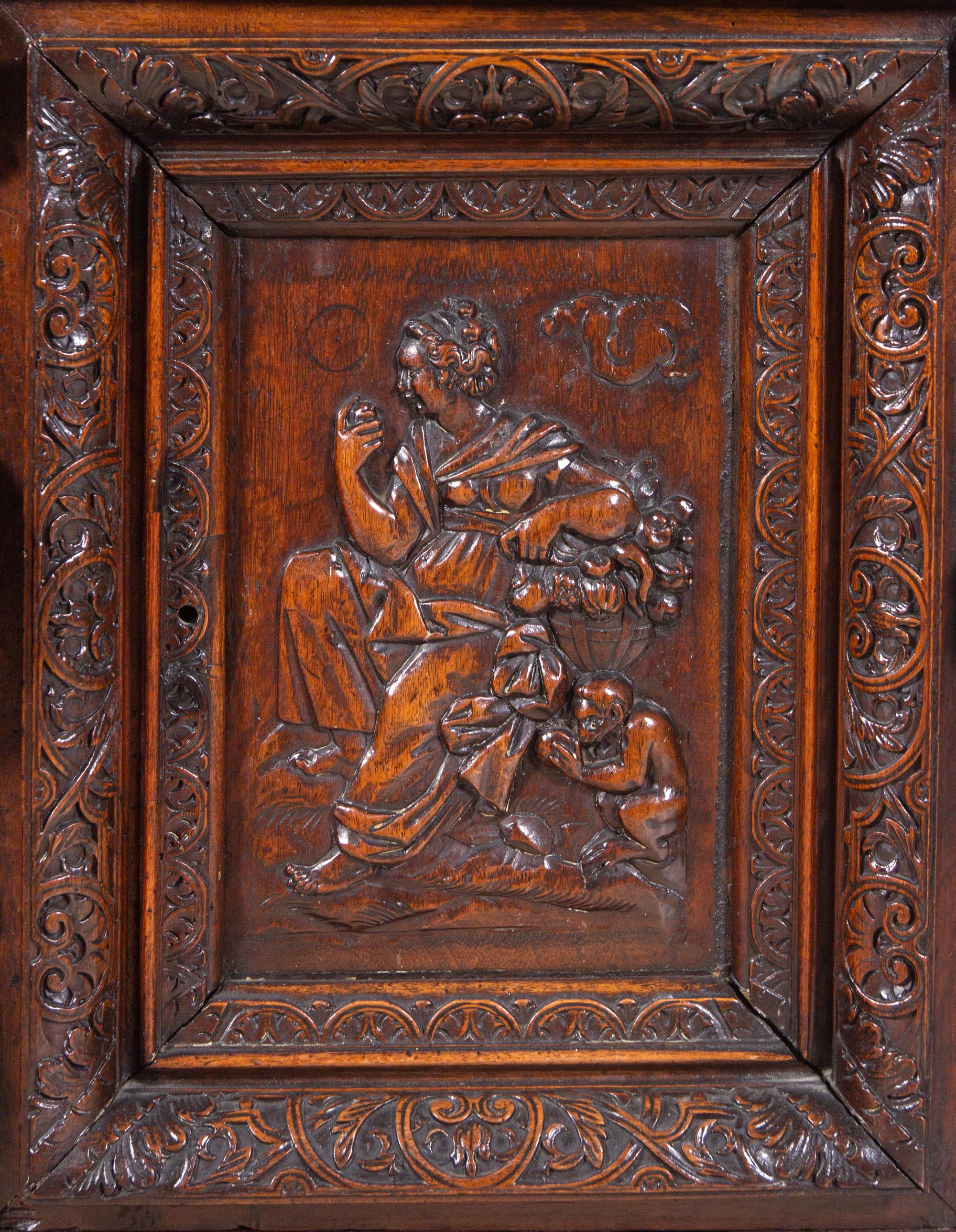 A Renaissance Revival Carved Walnut Marble-Top Cabinet