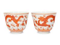 A Pair of Iron Red Porcelain 'Dragon' Wine Cups
