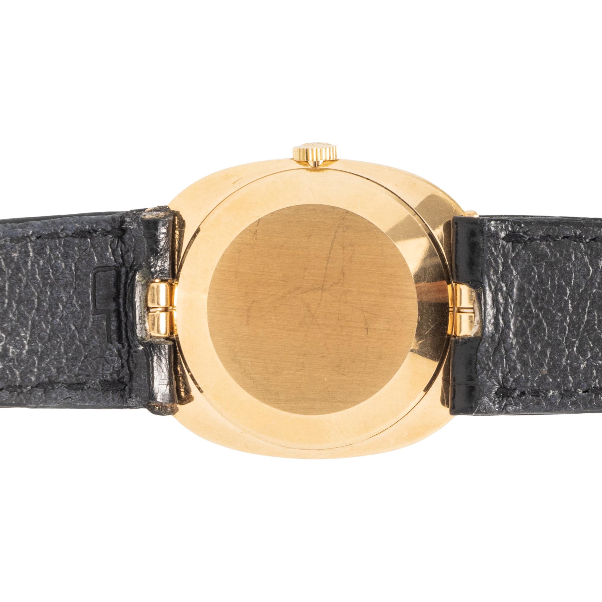 PATEK PHILIPPE, 18K YELLOW GOLD 'ELLIPSE' WATCH WITH TROPICAL BLUE DIAL