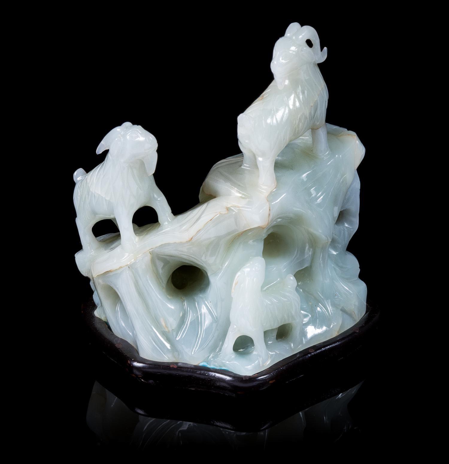 A White Jade Carving of Three Rams Height 4 inches. — 20TH CENTURY