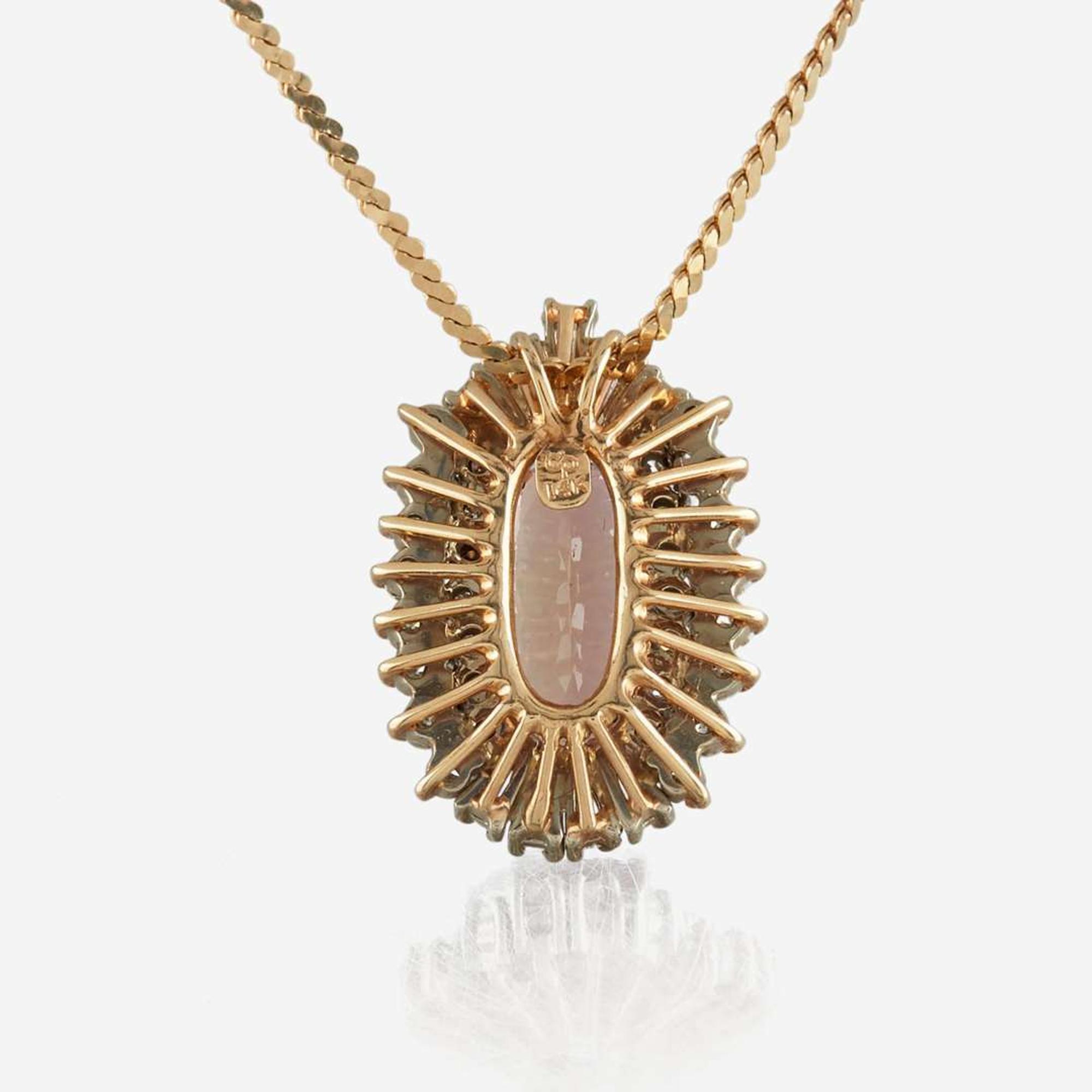 A topaz, diamond, and gold pendant