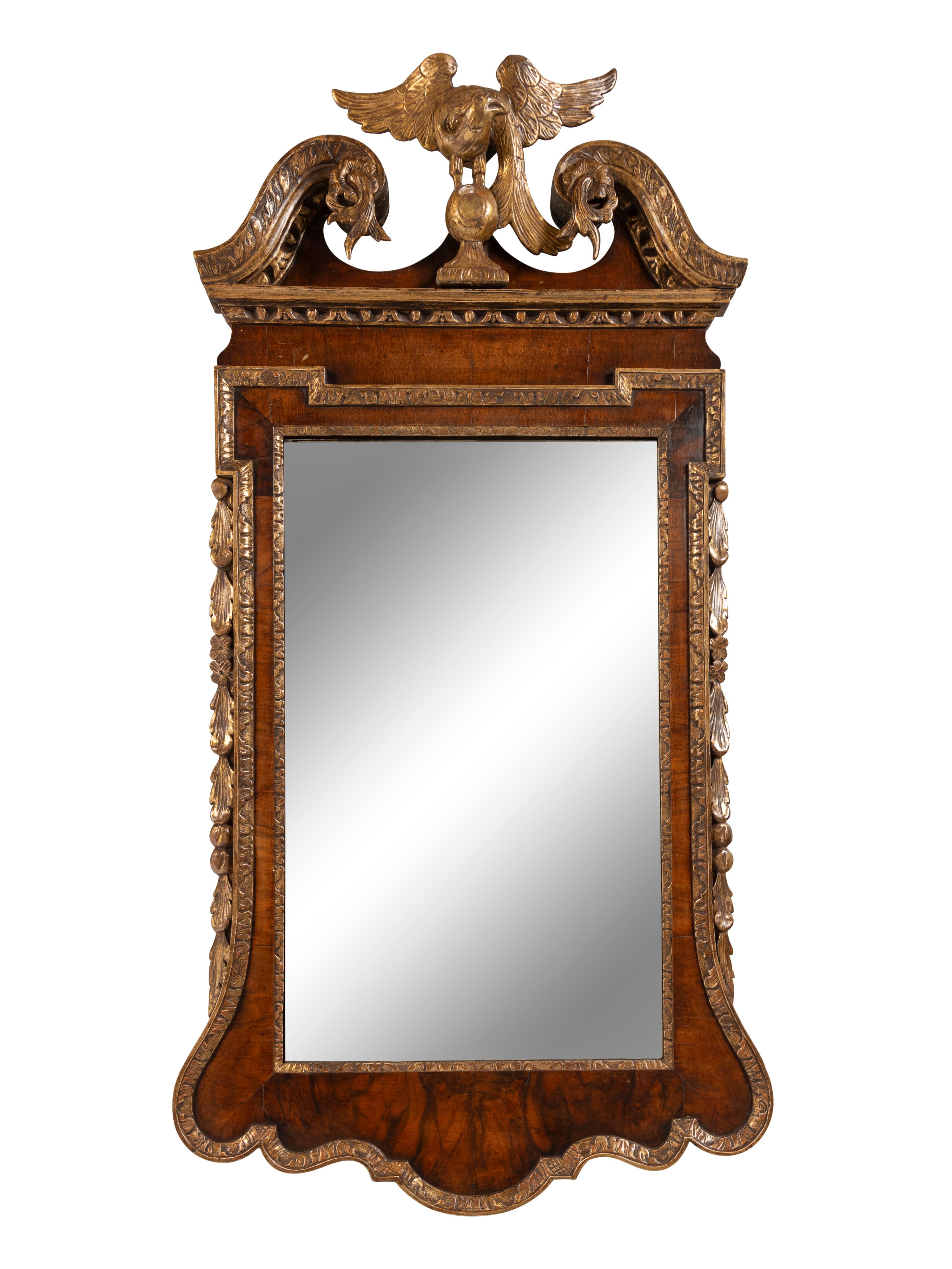 A George II Walnut and Parcel Gilt Mirror